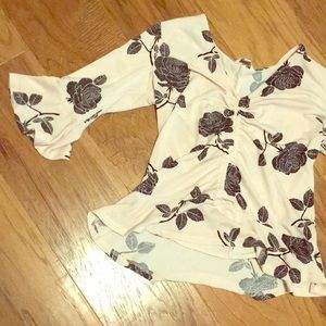 Pink, floral print, very stretchy, flowy shirt.